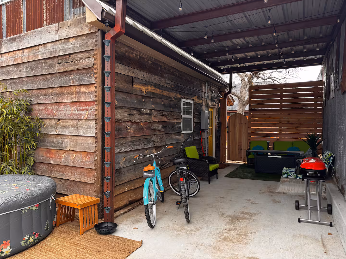 Patio with hot tub, bikes & grill