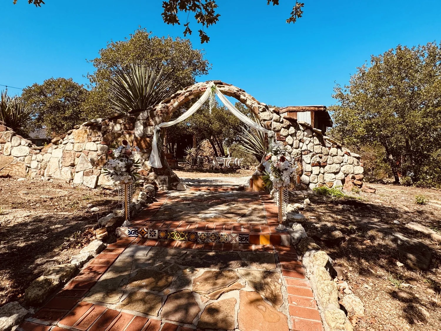 Ceremony arch dressed with florals