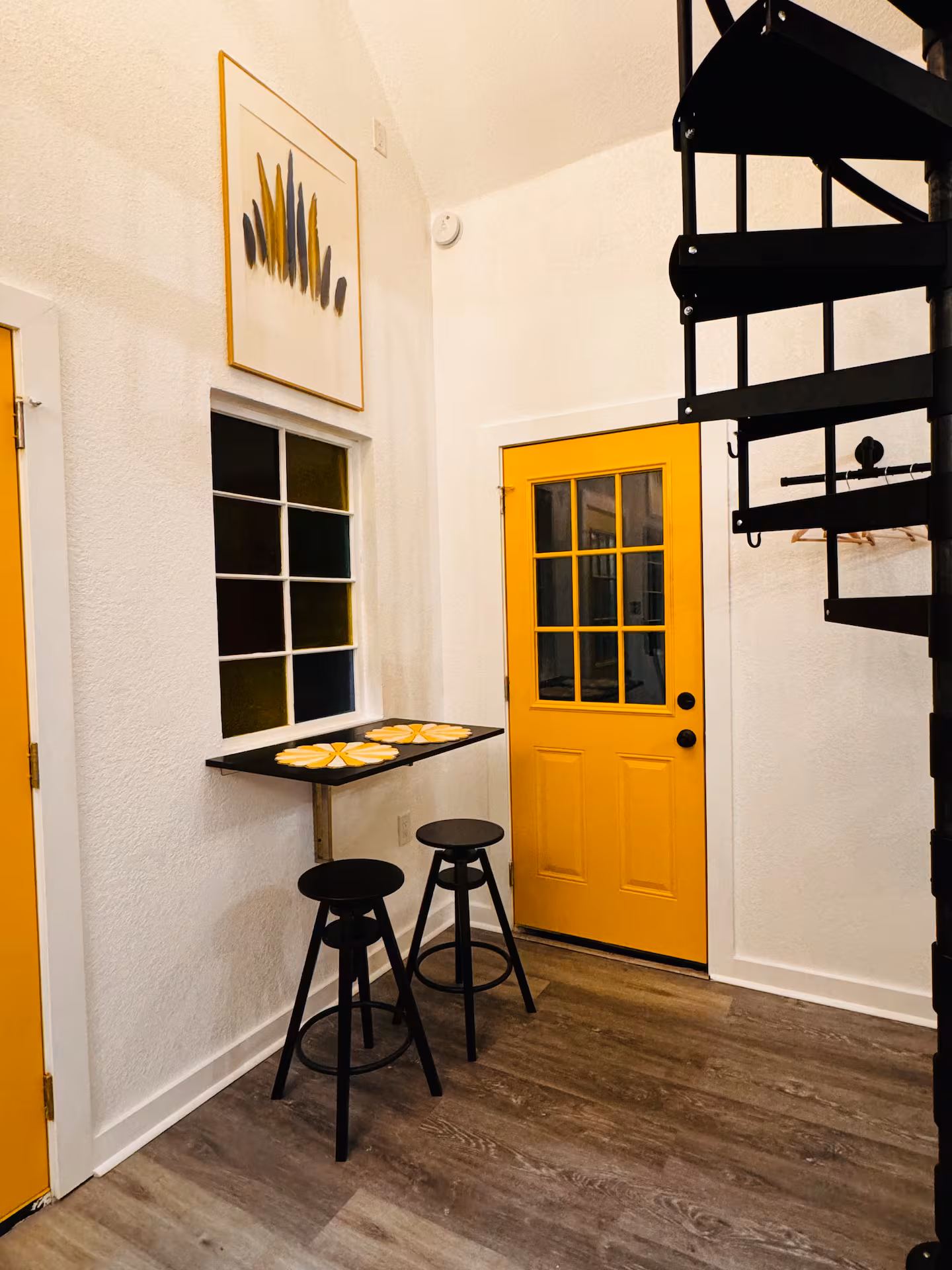 Entry with the signature yellow door