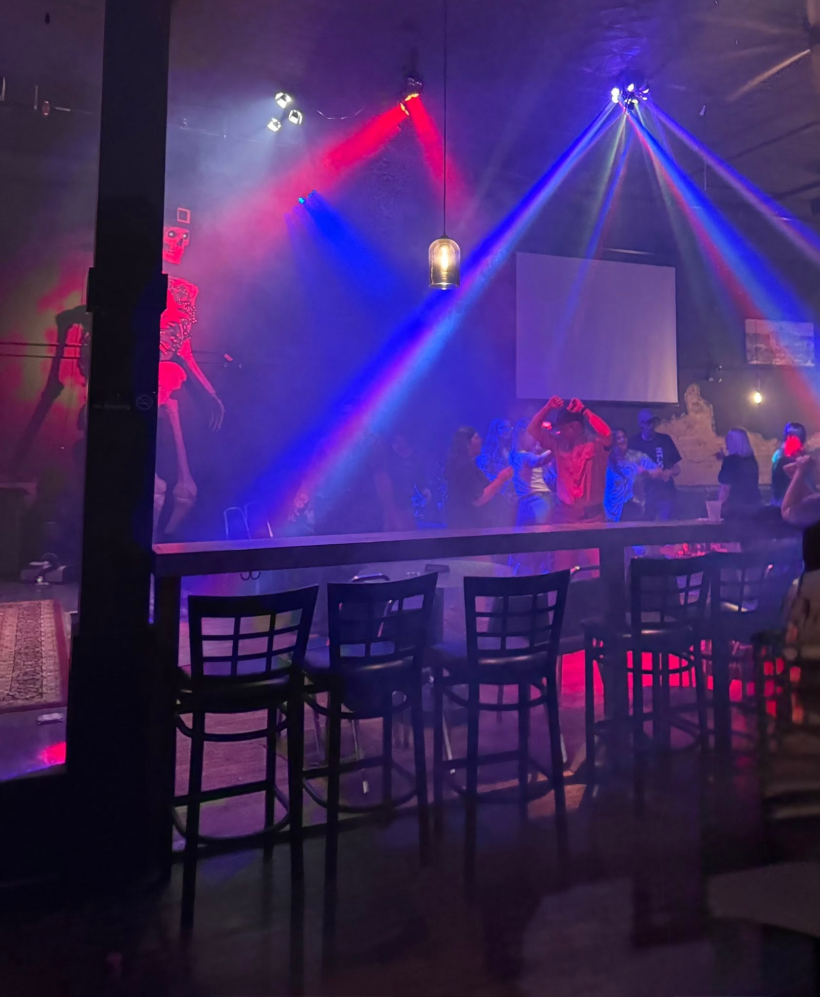 The Blind Pig dance floor lit in deep red and purple.